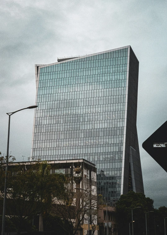 a large building with two towers sits on a road