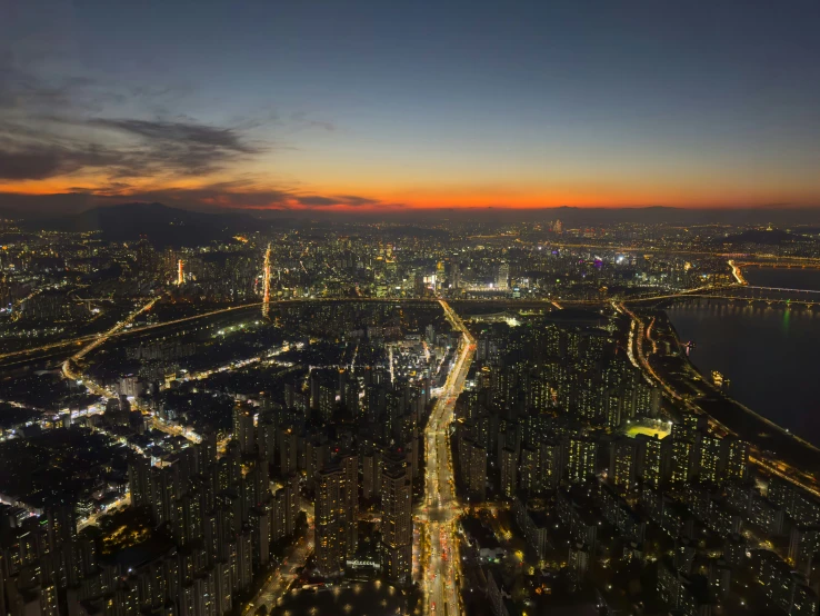 an overview of a city with lots of buildings at night