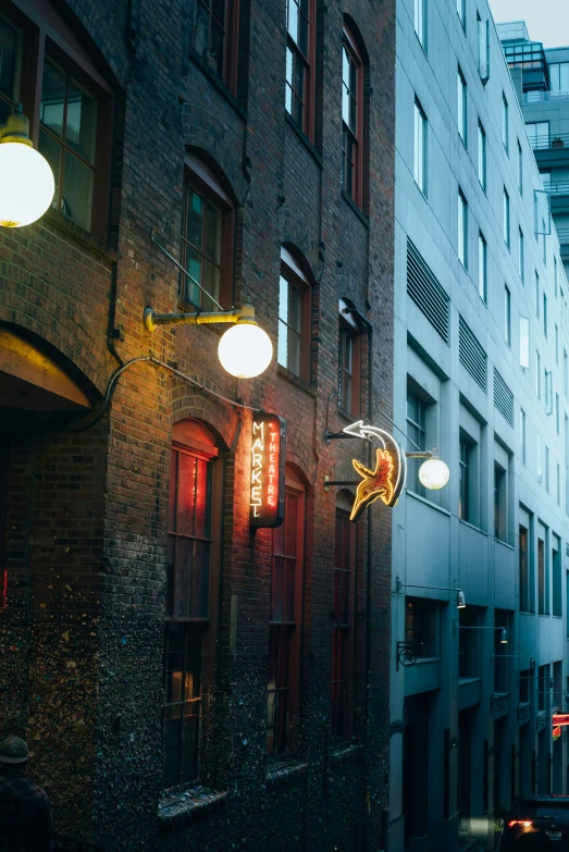 the light shines brightly on the side of a building in a city