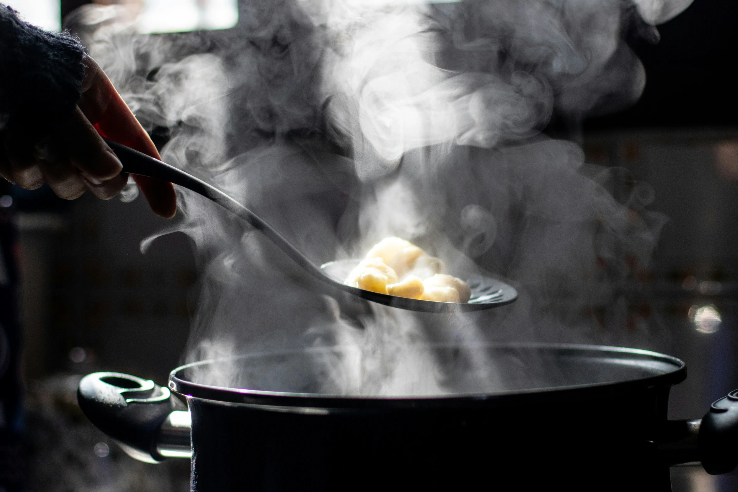 someone is cooking some kind of food on the kitchen stove