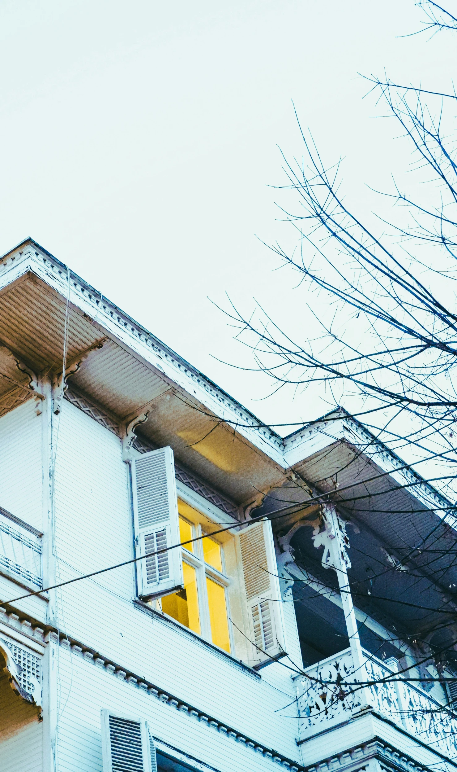 some very pretty looking windows on an old house