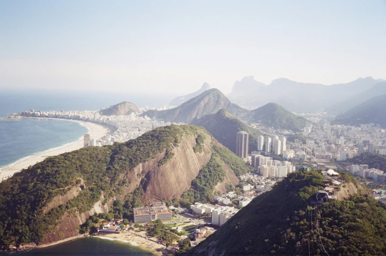 a view of a city below the cliffs and coast