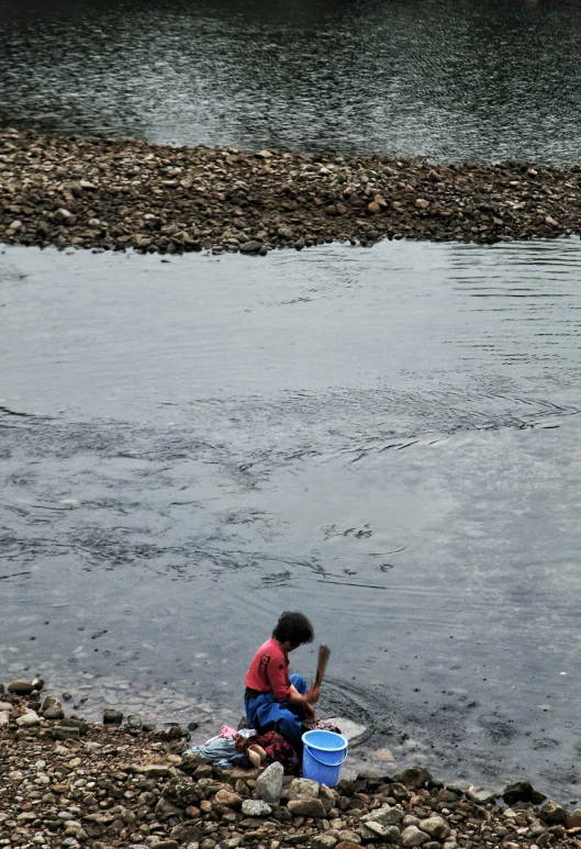 there is a child that is playing in the water