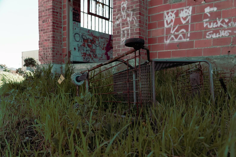 a abandoned brick building with a bike next to it