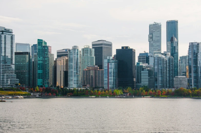 a city with a large body of water on a cloudy day