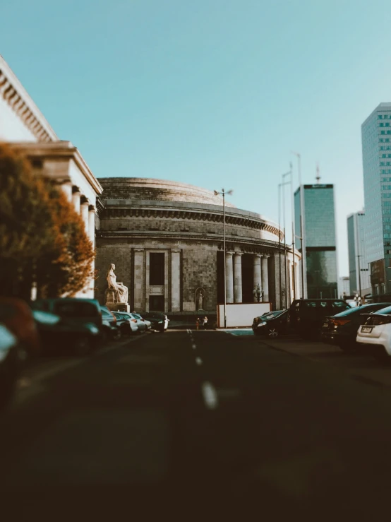 a car driving past a building on a road