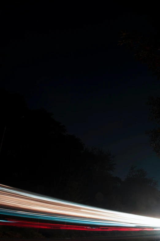 a car driving at night with motion blur