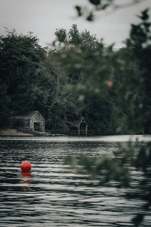 a body of water that has a red object in it