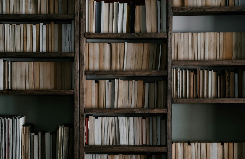 a book case full of lots of books in it