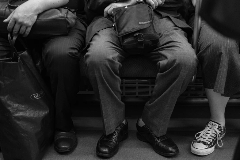 a man sitting next to a woman on a train