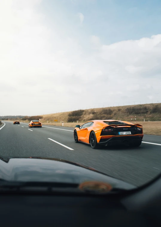 a number of cars going down a highway