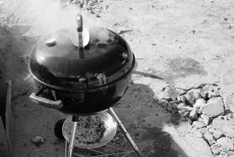 a barbecue is placed outside on an outdoor grill