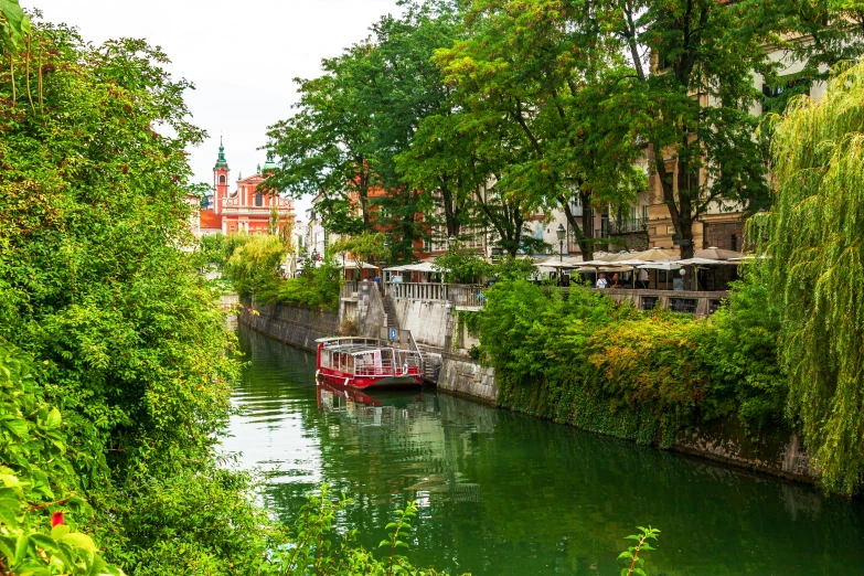 the narrow canal flows through a small city