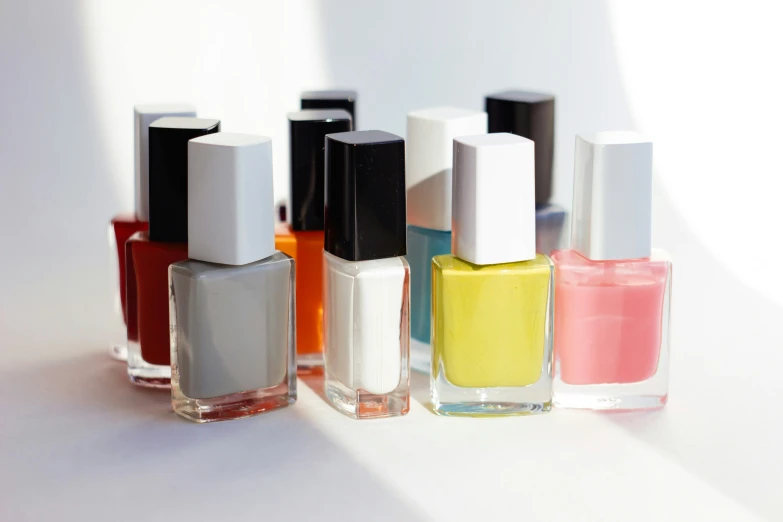 a group of bottles sitting on top of a white table