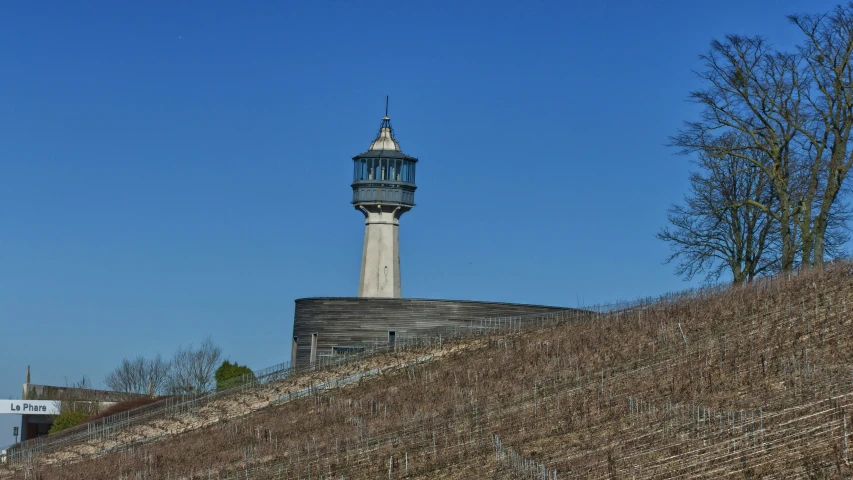 an old light house with a very steep hill