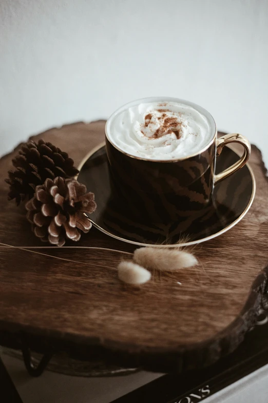 a close up of a cup of coffee on a plate