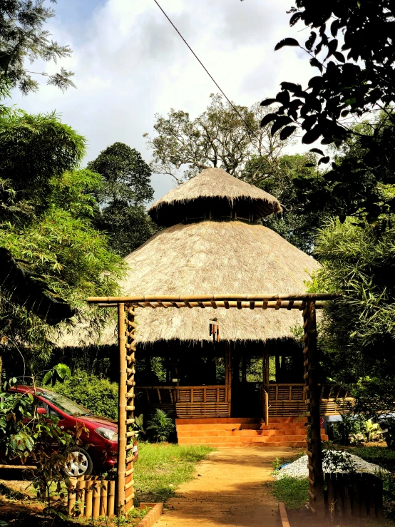 a native house built around a thatched roof