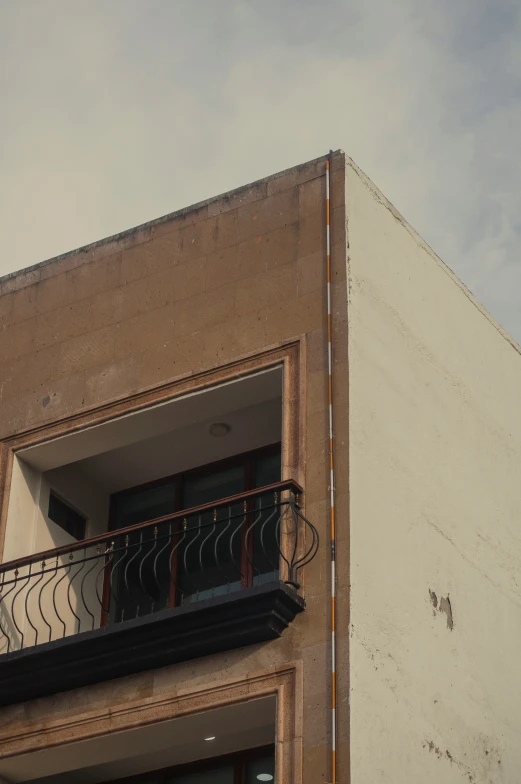 a building with an open window and a balcony