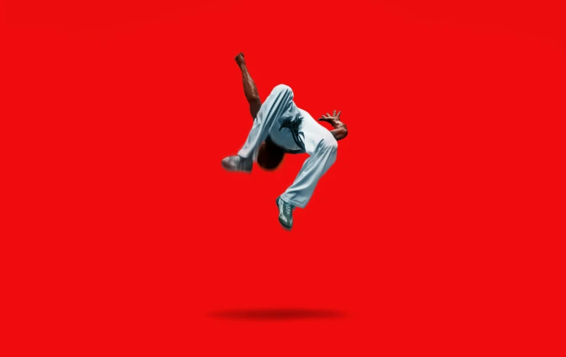 man in the air and an artistically red background