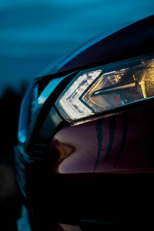 a close up view of the headlights on a car