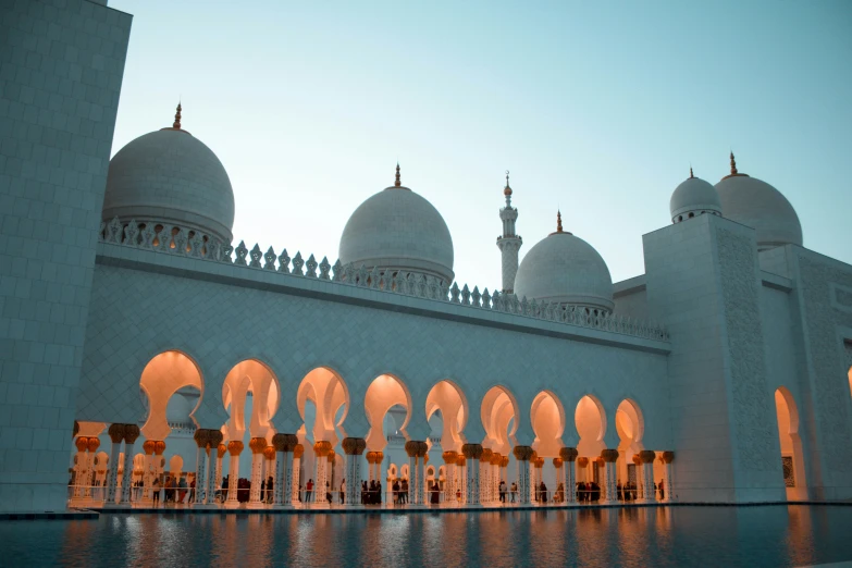 the domes of a large, white building at dusk