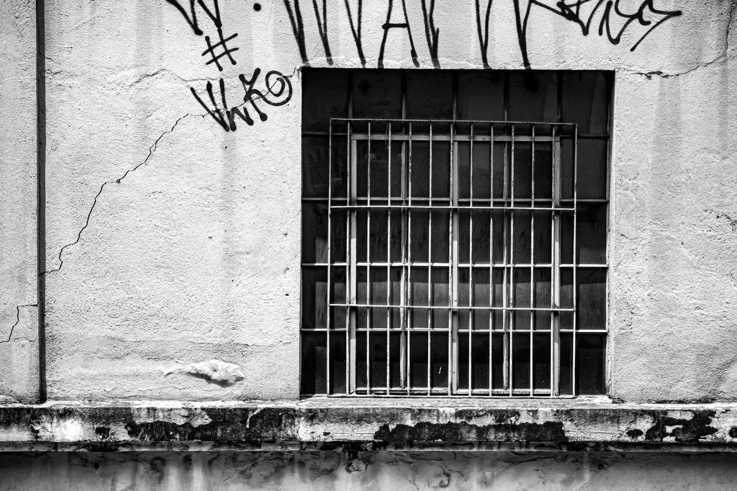 a window that has been placed to show graffiti on the wall