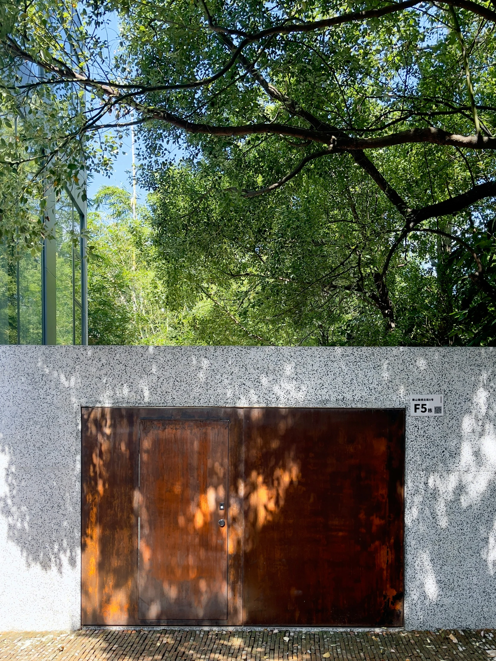 three doors and a bench set up against the wall