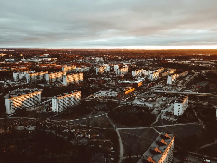 an aerial view of buildings, buildings, and a river