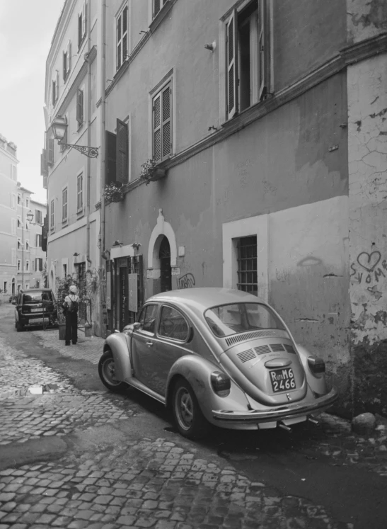 a vintage po of a car parked in front of a building