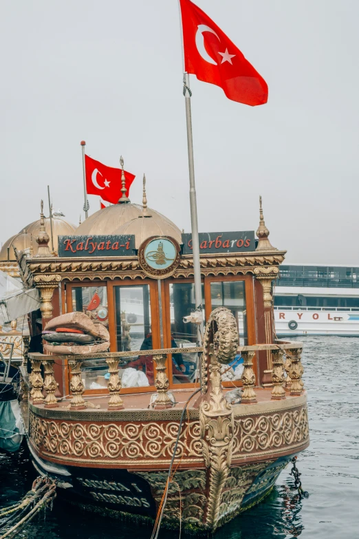 a boat that has some flags on it