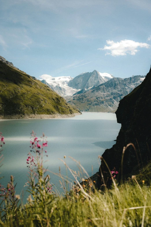 there is some water in the middle of a mountain lake