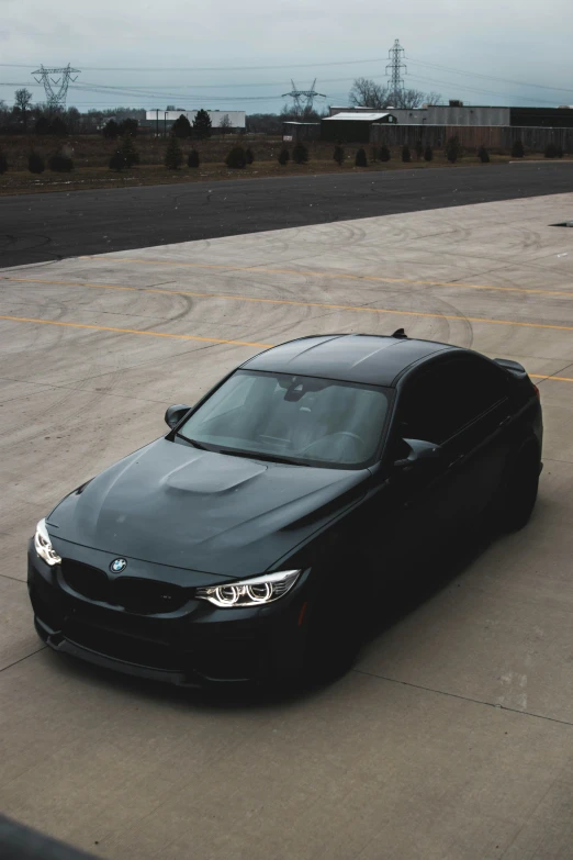 a car sitting in a parking lot near an airport