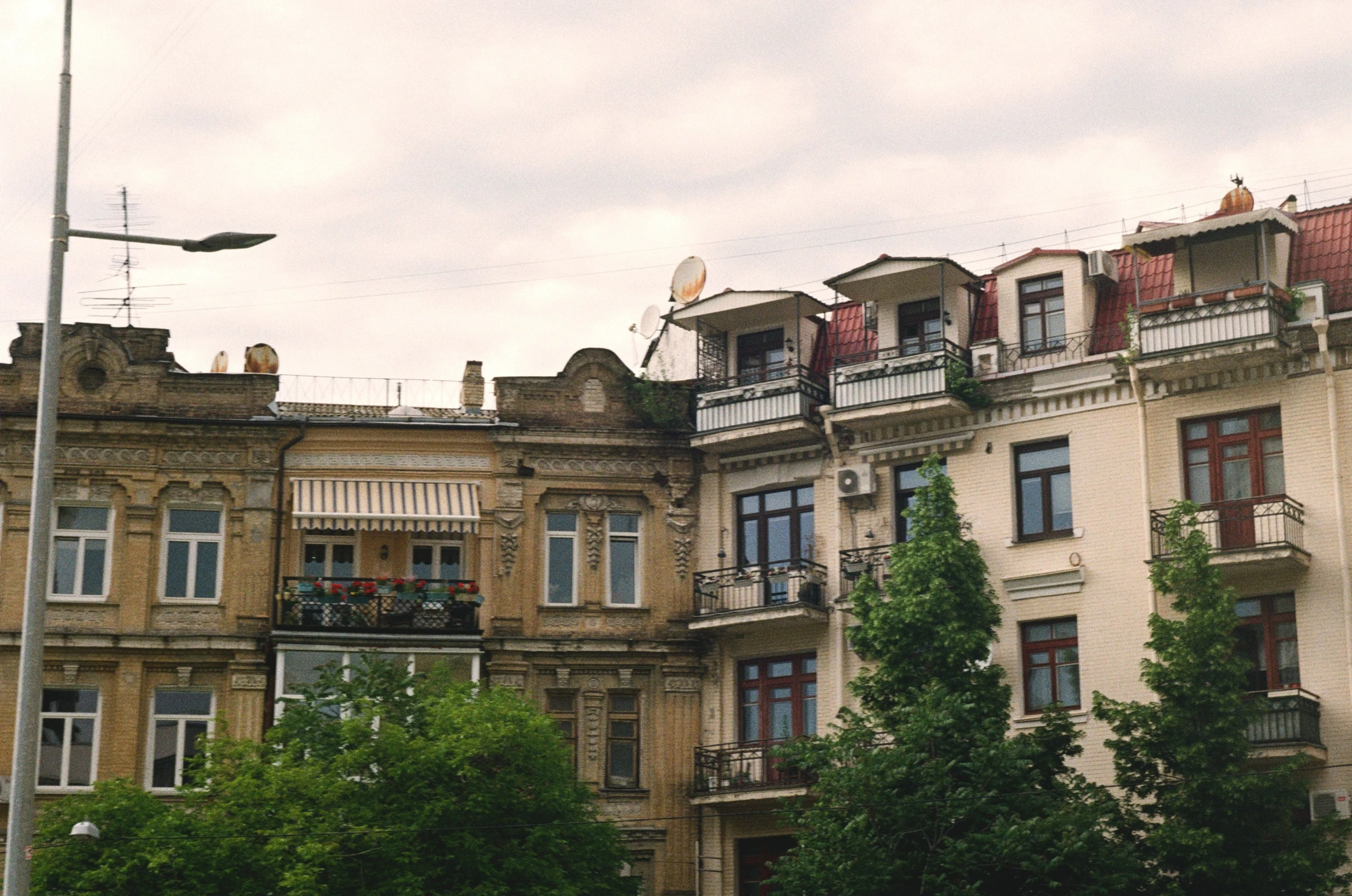 old houses in the city with lots of windows