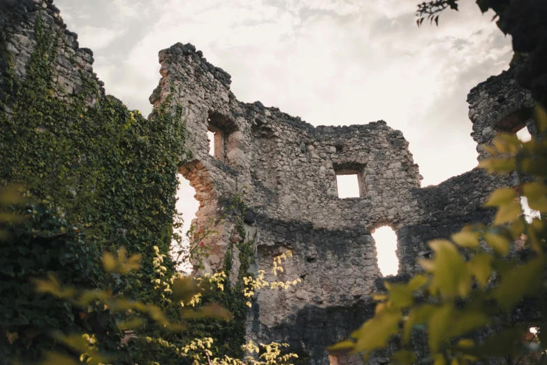 an old stone structure with holes in the middle