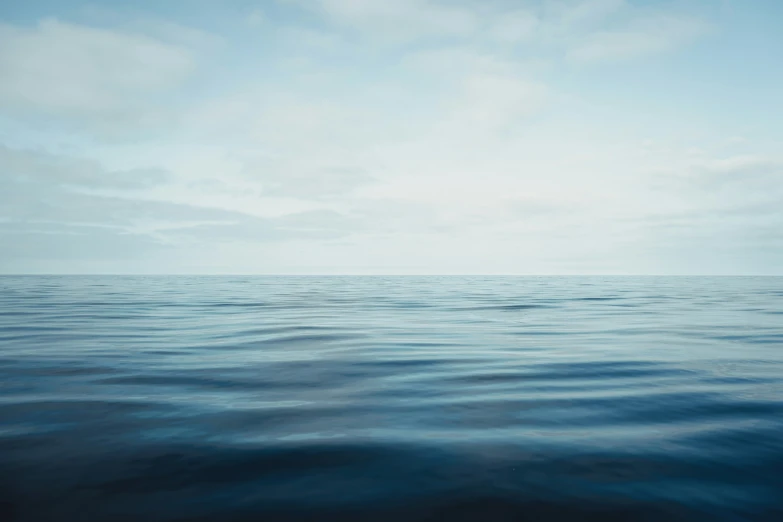 the blue ocean and sky is very peaceful