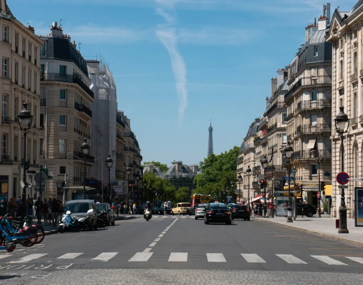 a very wide city street with several vehicles