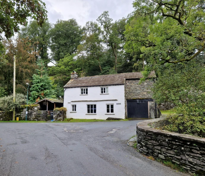 an image of a home with stone fences