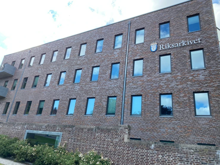 the front view of a red brick building