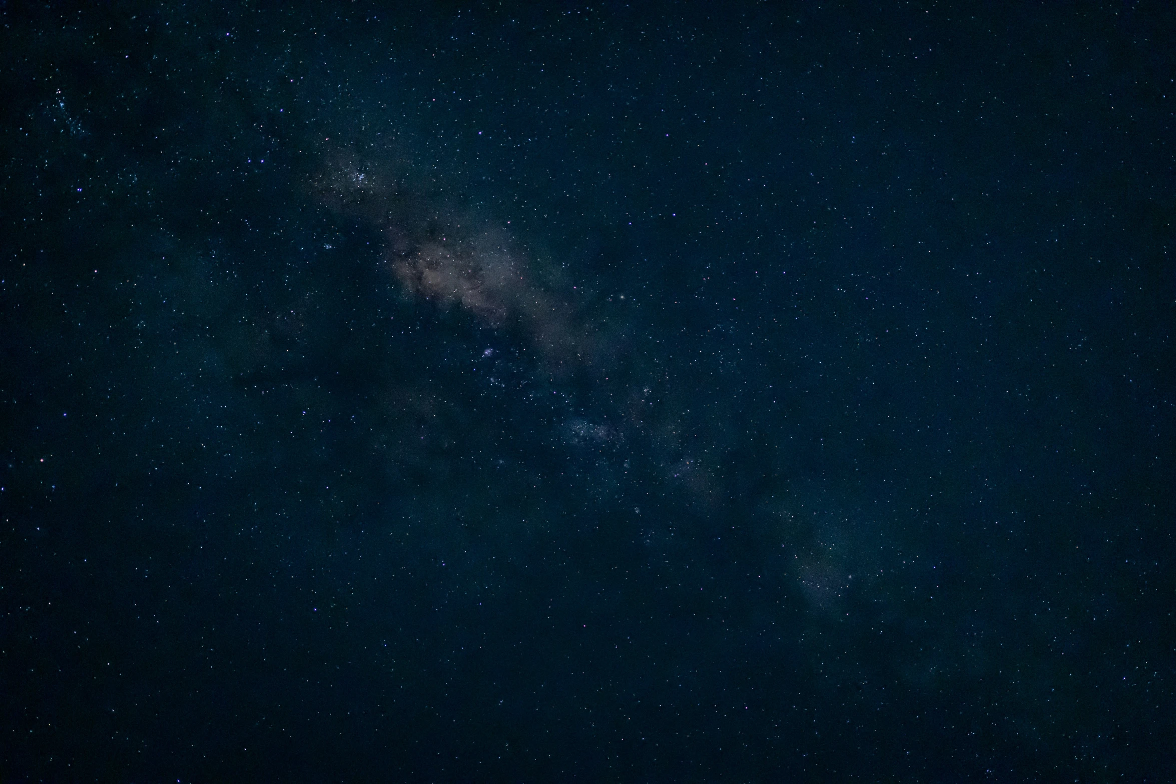 the starry sky is filled with stars and the silhouettes of two people