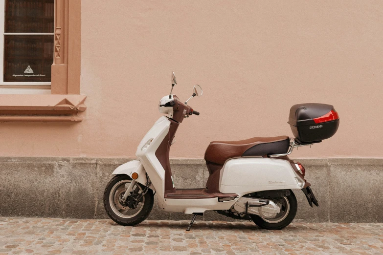 a motorcycle parked on the street in front of a building