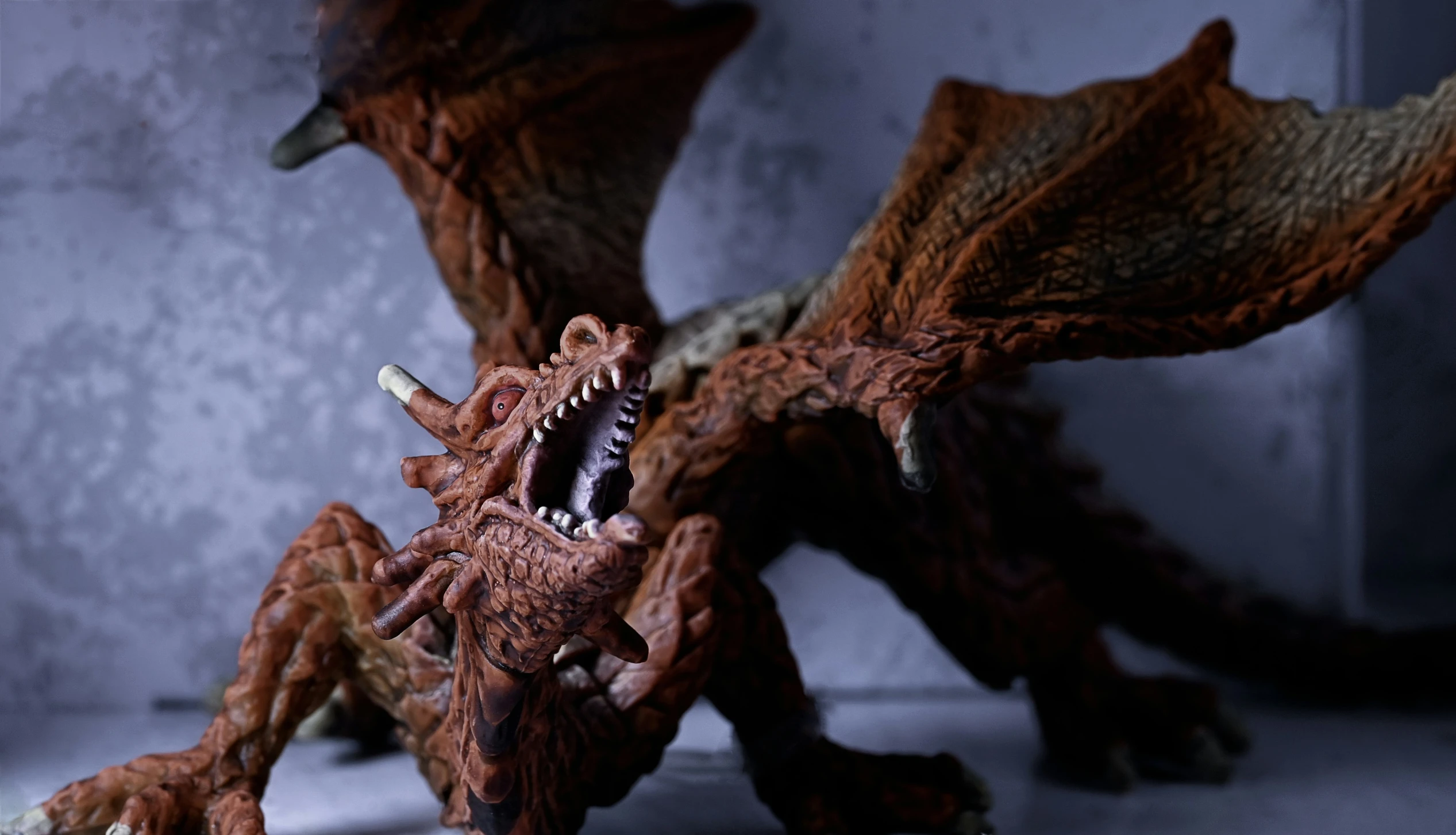 an articulated model of a dragon with sharp teeth