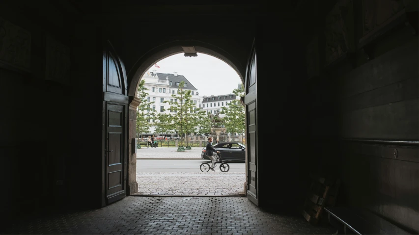 an old and cobblestone sidewalk with a bicycle going in through it