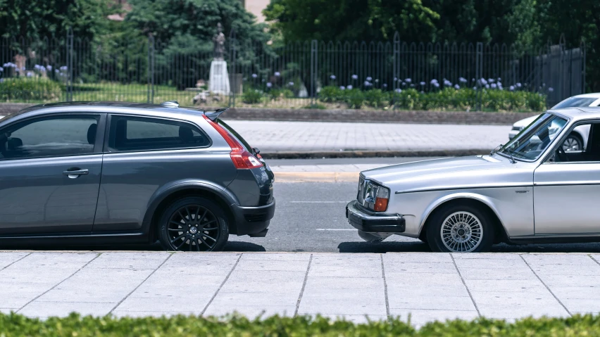 two cars parked next to each other at the same time