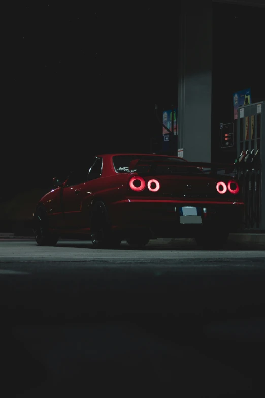 a car that is sitting in the dark