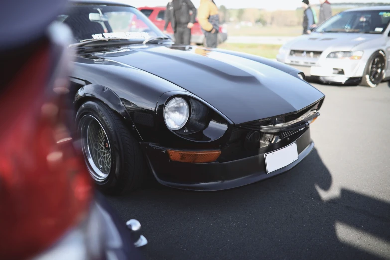 some cars are lined up at the show