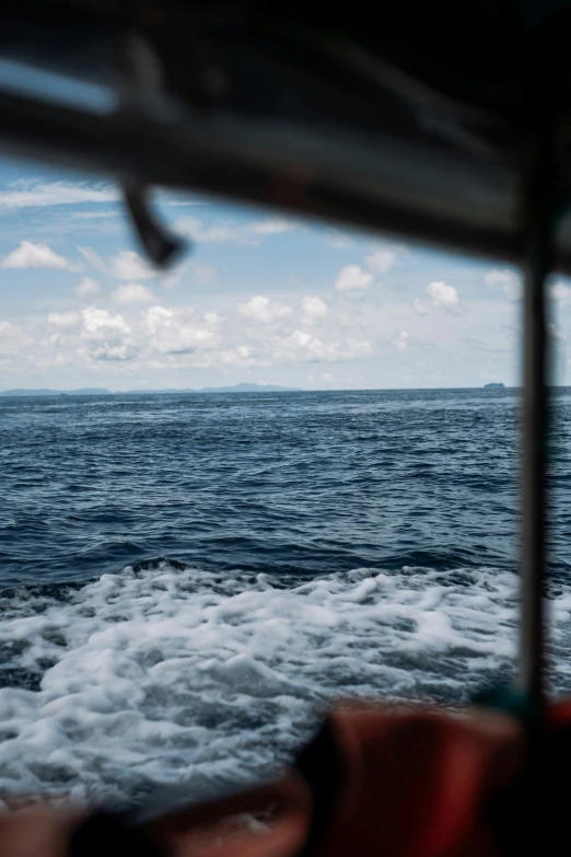 a view of a boat heading toward the water