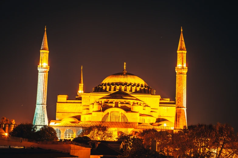 a large building lit up at night with many lights