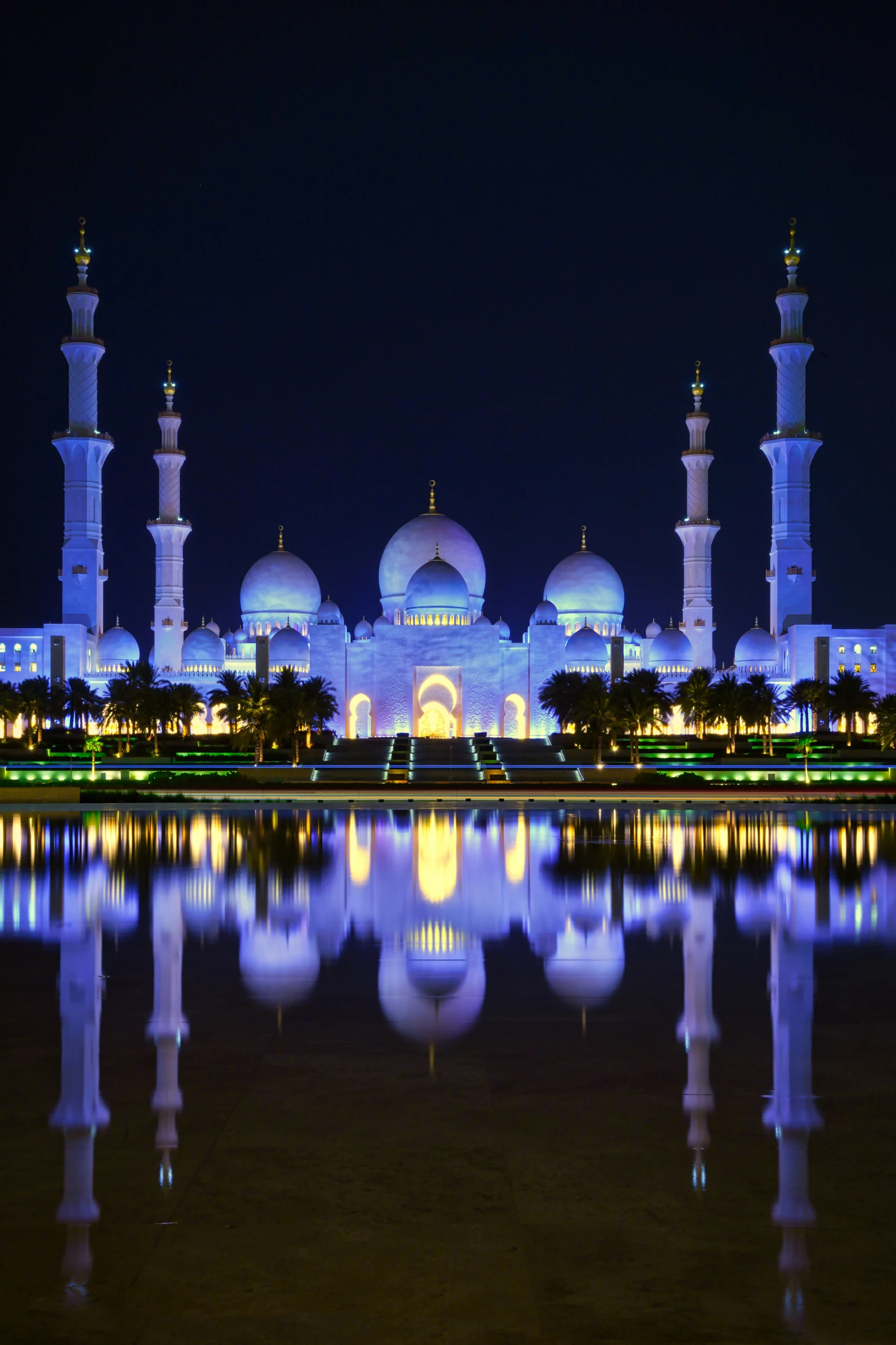 a large white building lit up at night