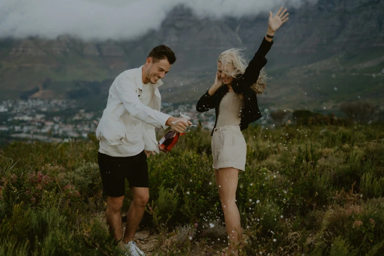 an engaged couple in the hills