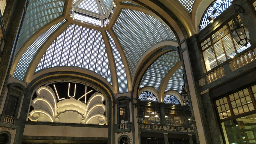 the inside view of a building with an ornate ceiling